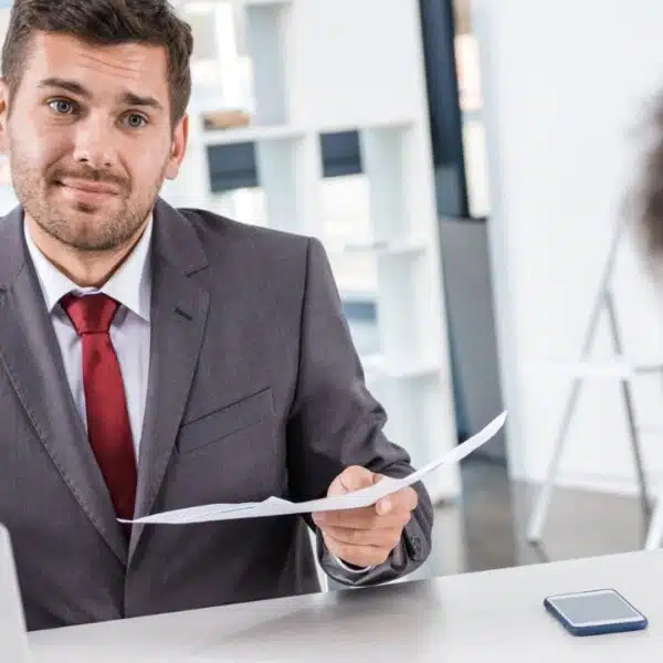 man talking to someone with paper