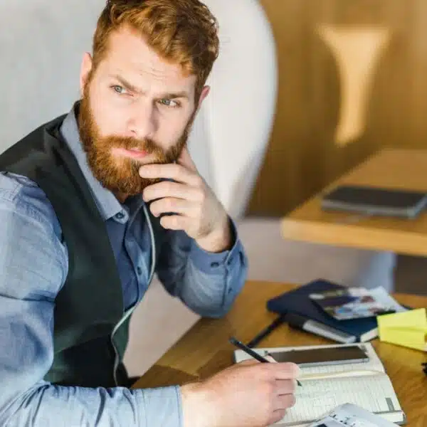 man thinking with a beard