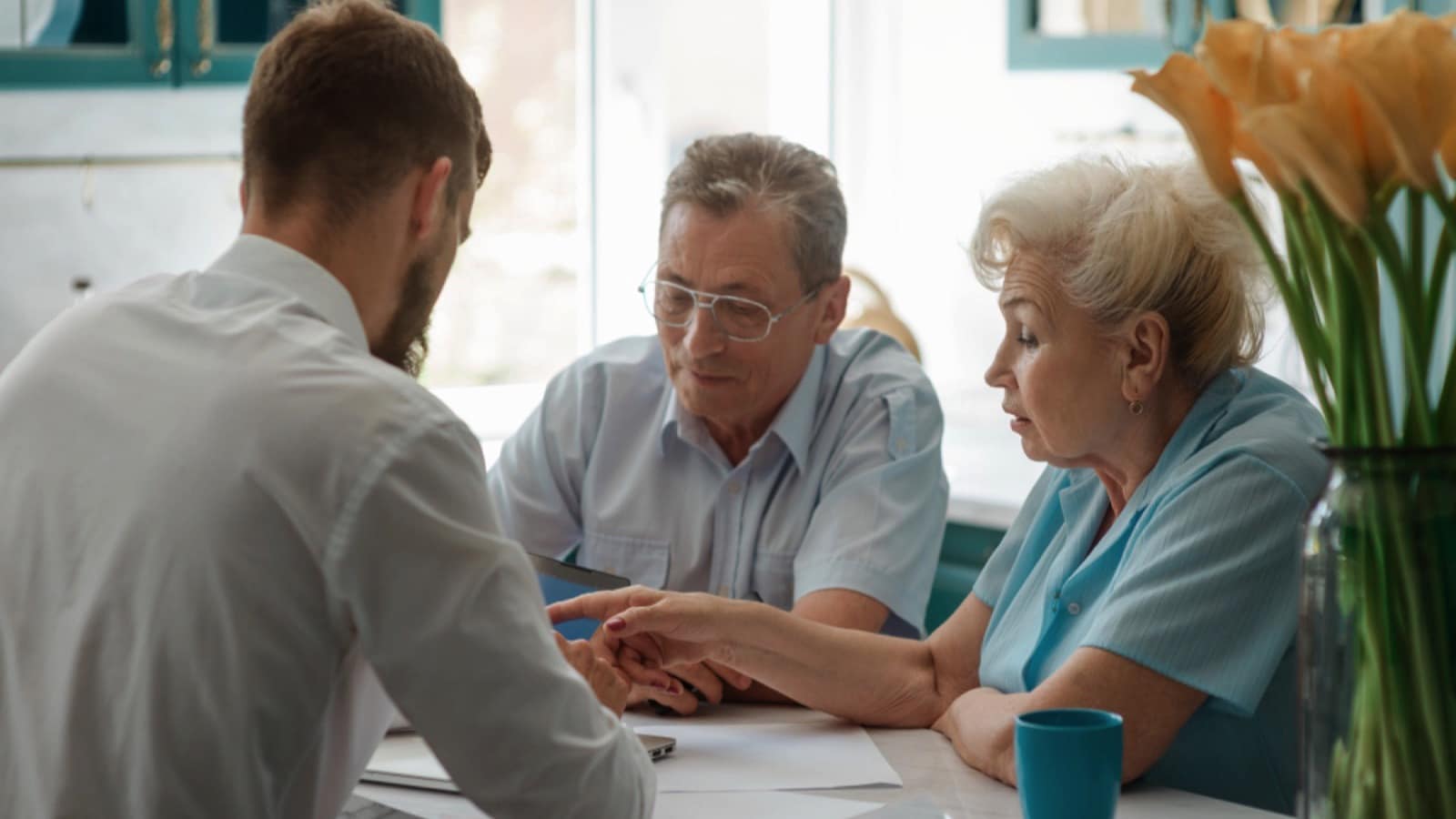 Signs You’re Stuck in a Middle‑Class Mindset Man discussing with parents