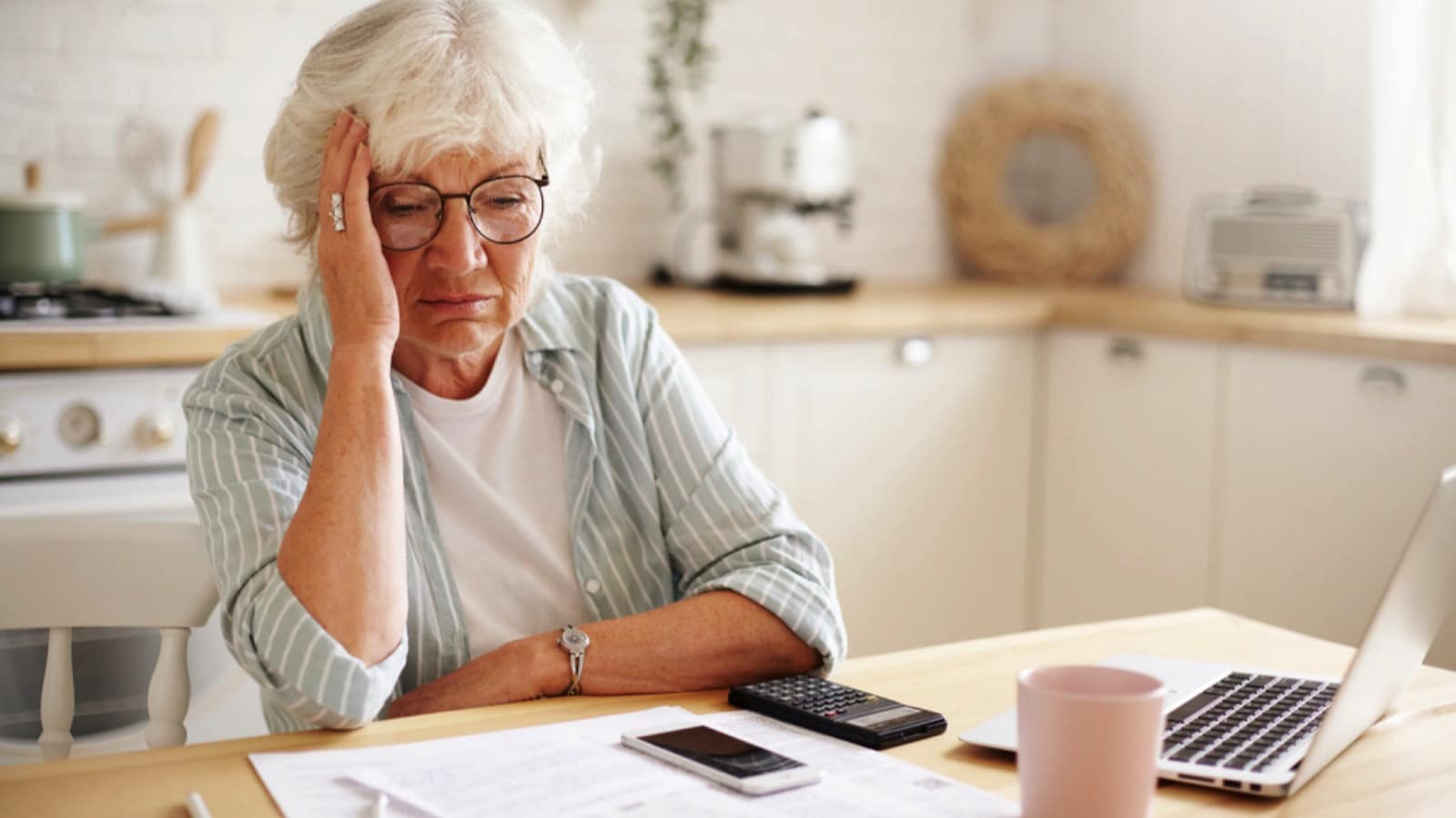 Old woman thinking about debt