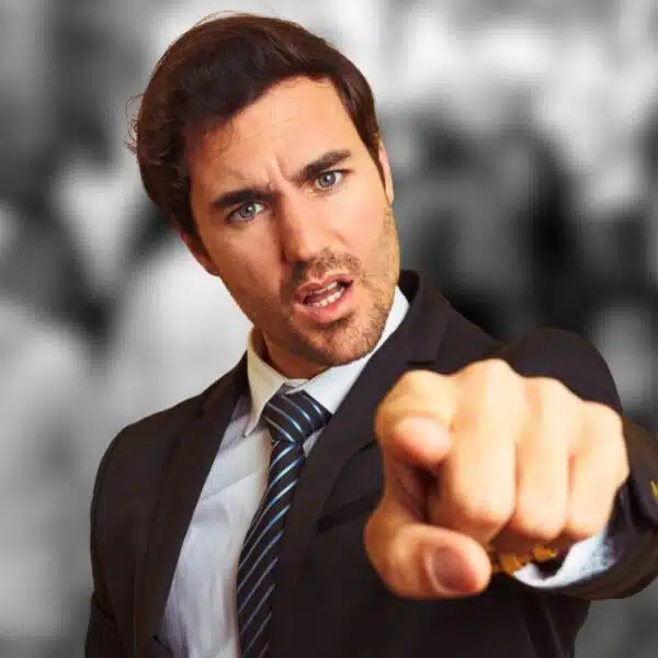man in suit pointing blaming