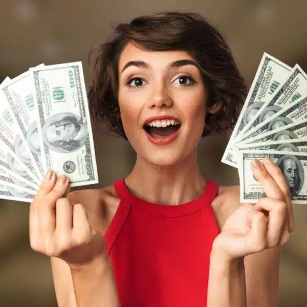 woman holding up money