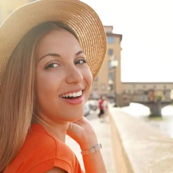 woman wearing hat traveling