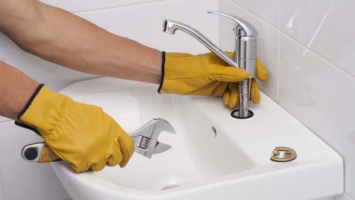 Home Upgrades That Can Boost Value for Less Installation of a faucet for a sink