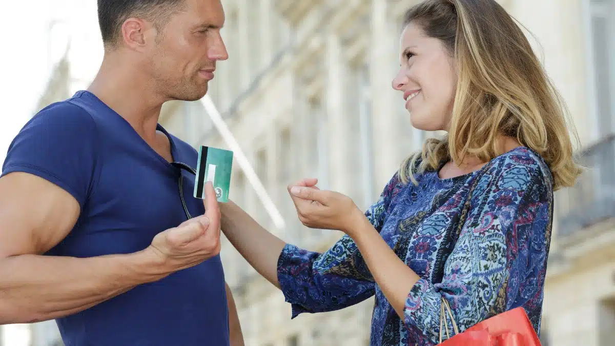 13 Everyday Habits That Quietly Shrink Your Paycheck Woman asks credit card from man