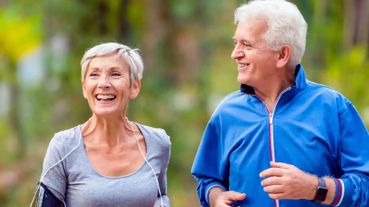elder couple running in the park