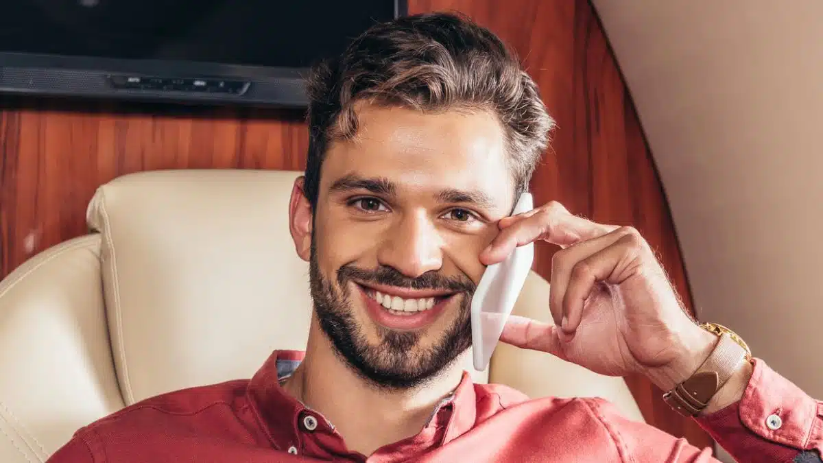 rich man drinking coffee on a plane