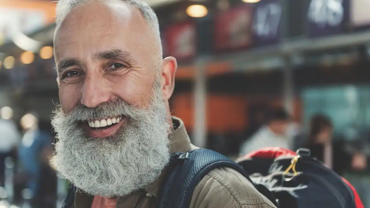 14 Rewarding Side Hustles Retirees Will Actually Enjoy senior man traveling