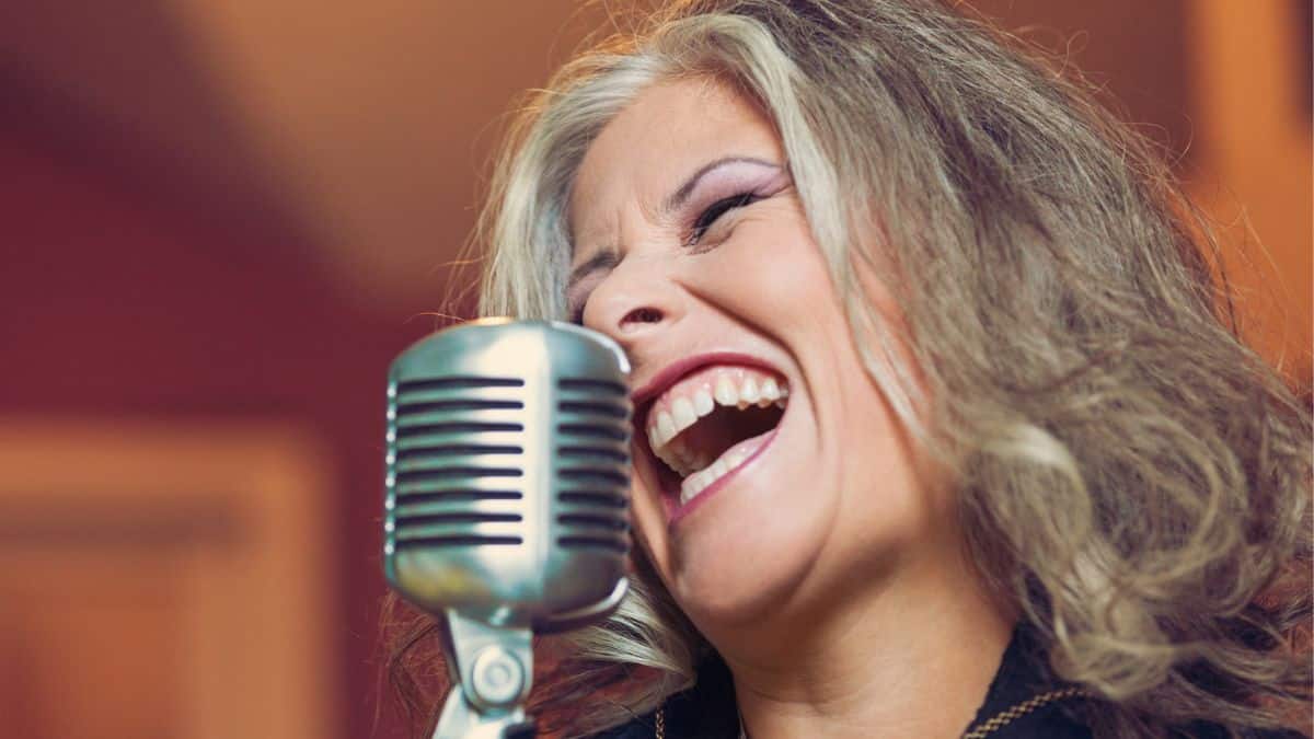 15 Surprising Ways Your Voice Can Make You Money woman singing into a microphone