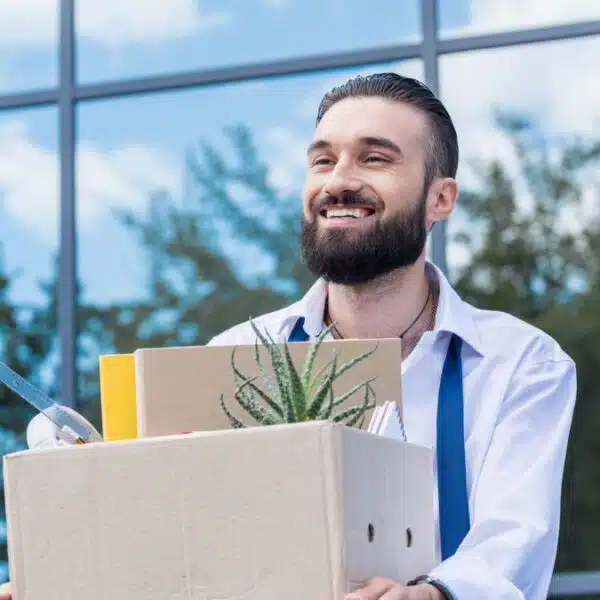 man carrying a box outside