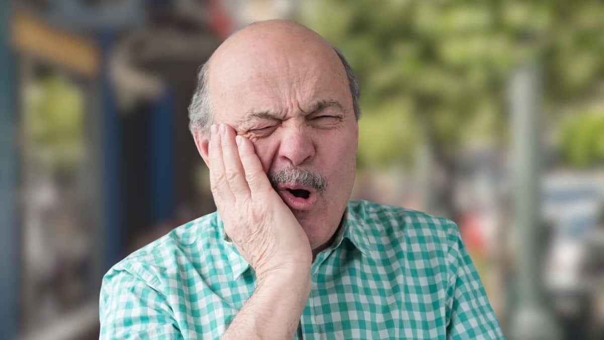 Retirement Habits That Ease Future Stress senior bald man in pain