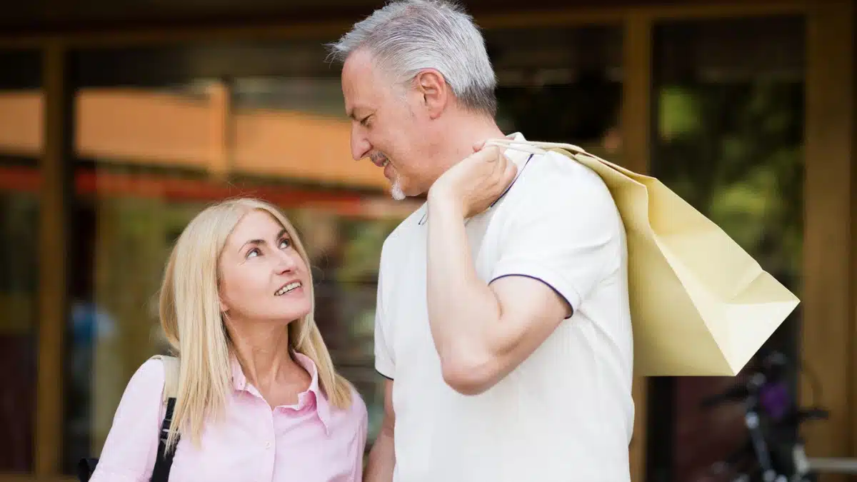 senior couple with shopping bag