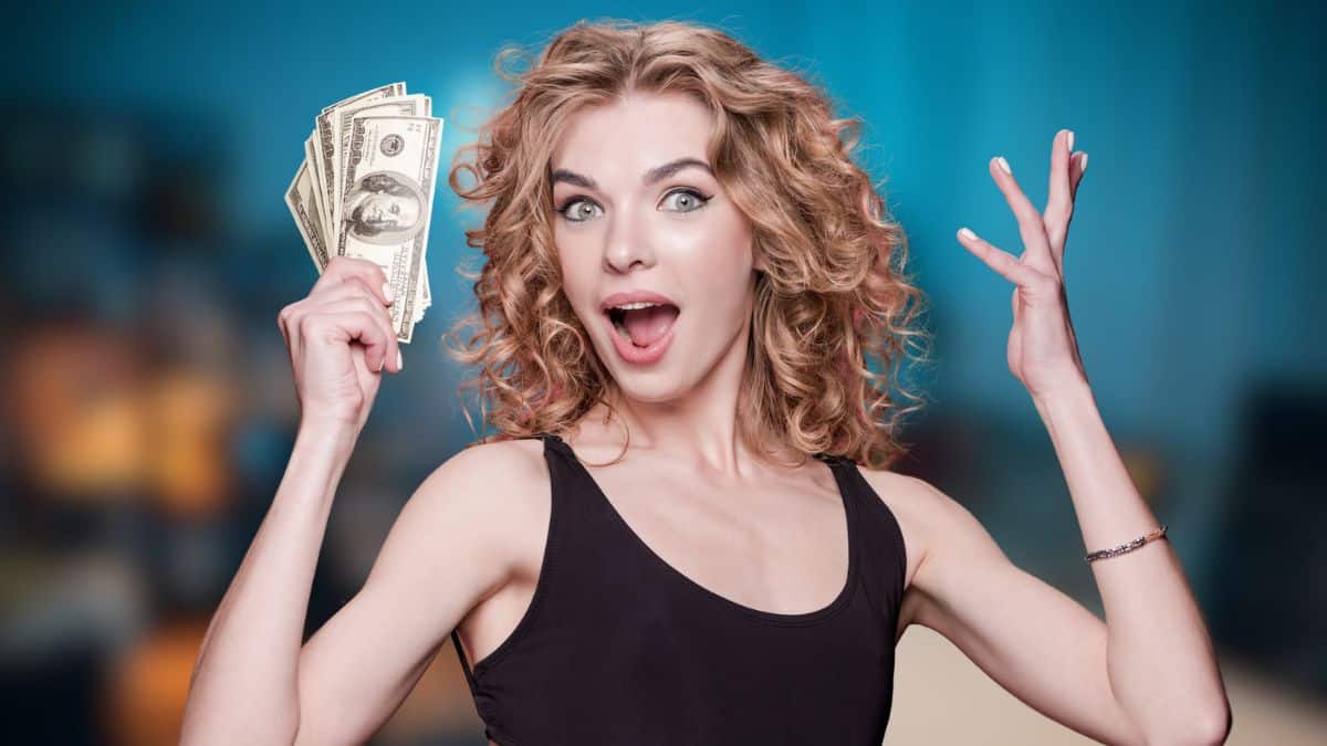 Signs Your Partner’s Hiding Financial Truths woman with cash at home