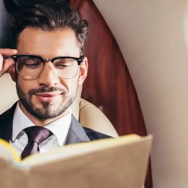 man reading a book glasses