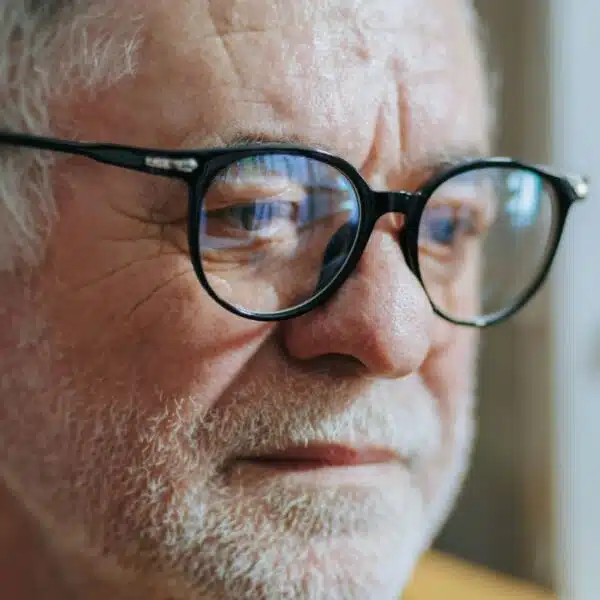 man with beard grey and glasses