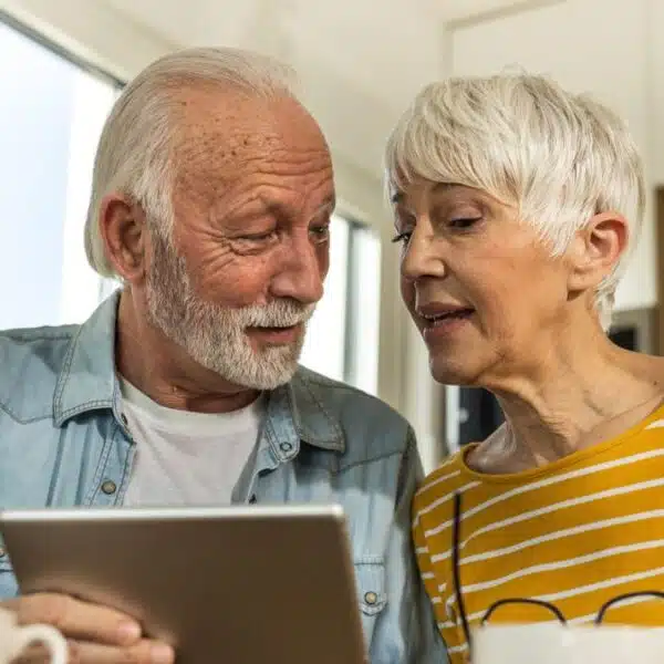 seniors happy on a tablet