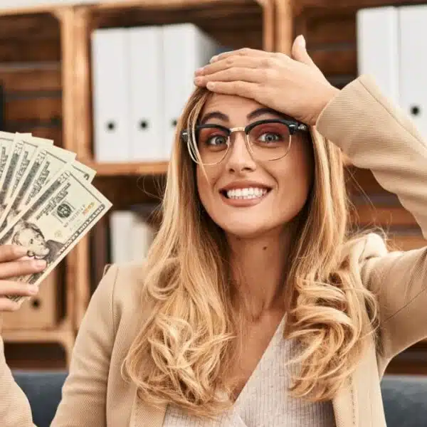 woman holding up money