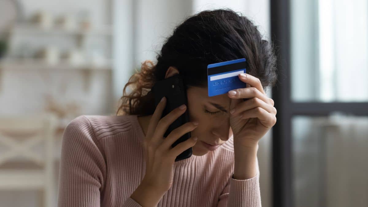 8 Key Reasons Side Hustles Often Fail woman with credit card on the phone