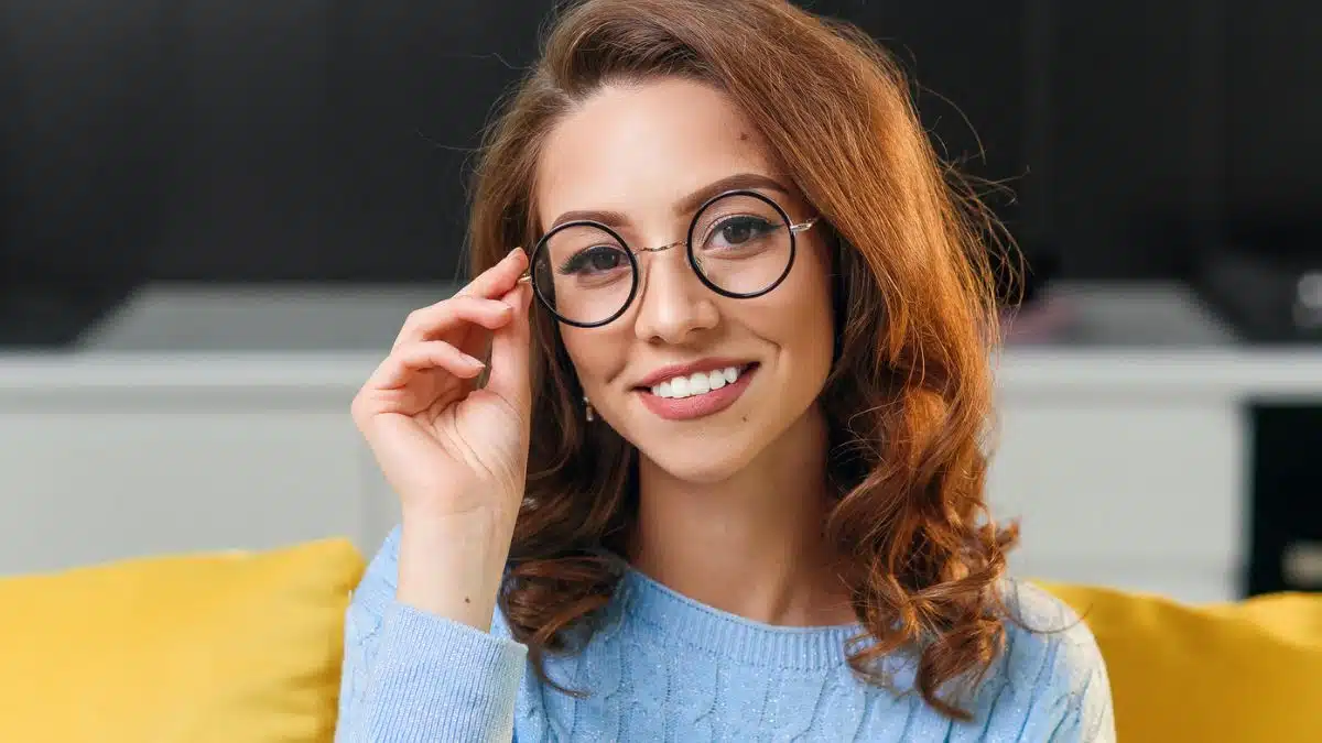 brunette glasses yellow couch