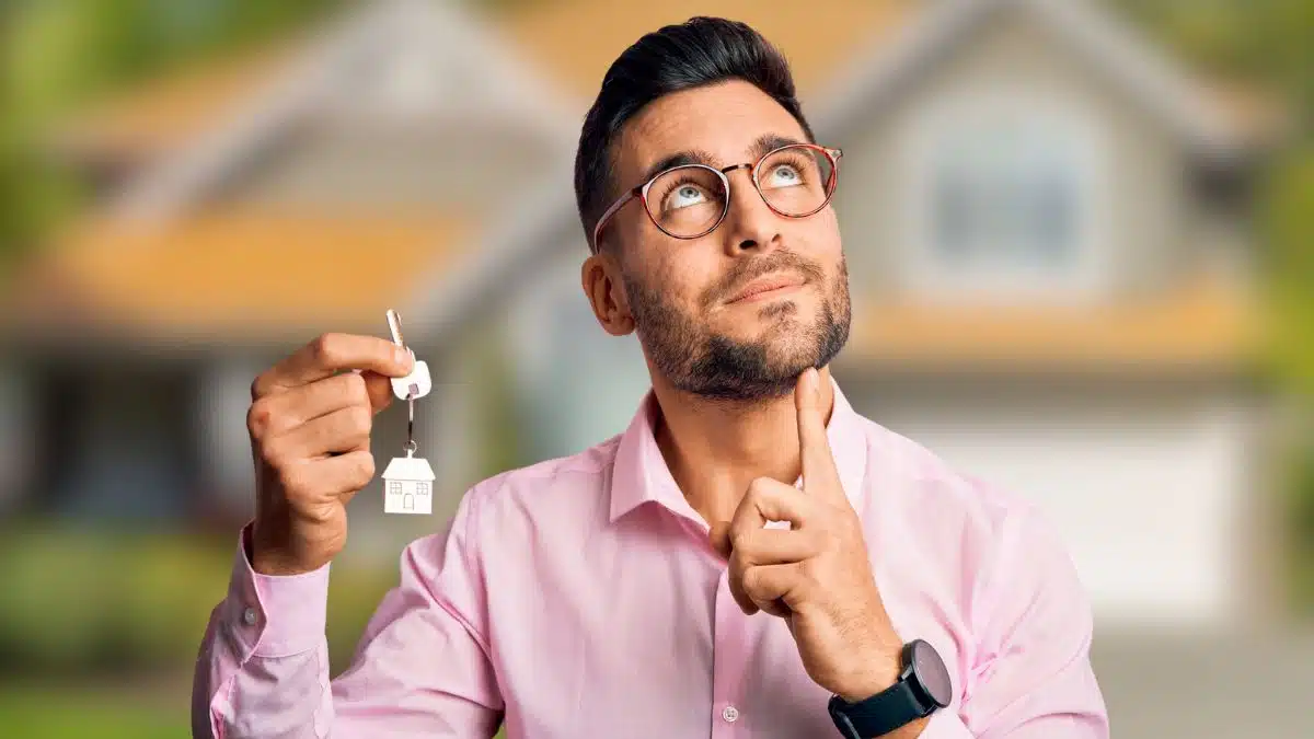 15 Clever Ways Savvy Travelers Stretch Every Dollar man holding a house key