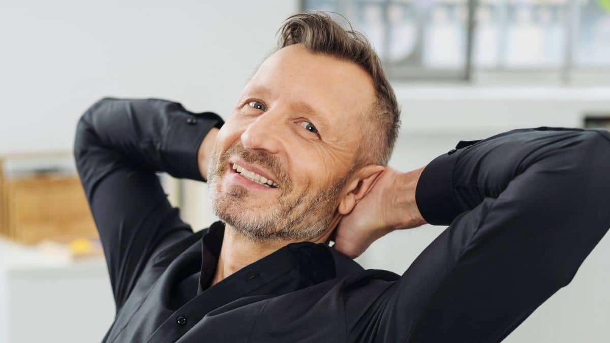 Habits Quietly That Can Sabotage Your Raise Potential man relaxing in an office