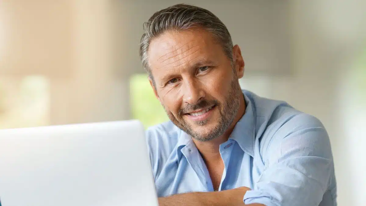 14 Unconventional Platforms Where Regular People Are Making Money mature man grey laptop