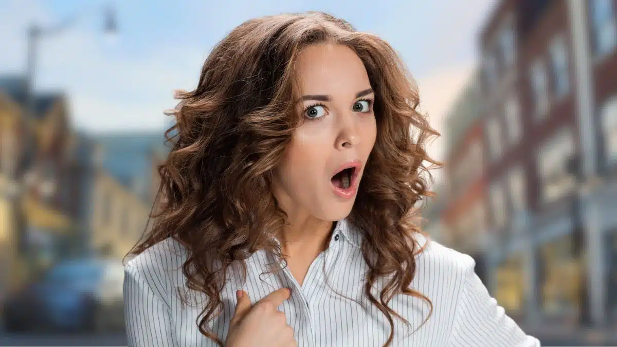 woman curly hair surprised in downtown