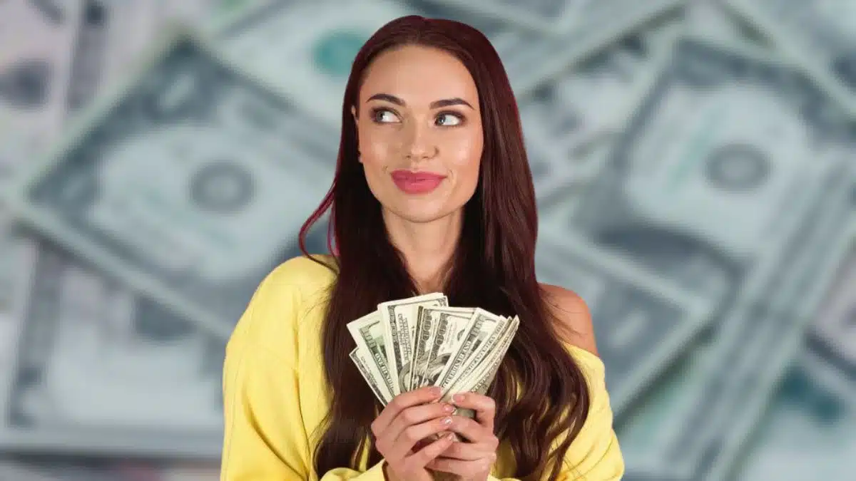 woman holding cash