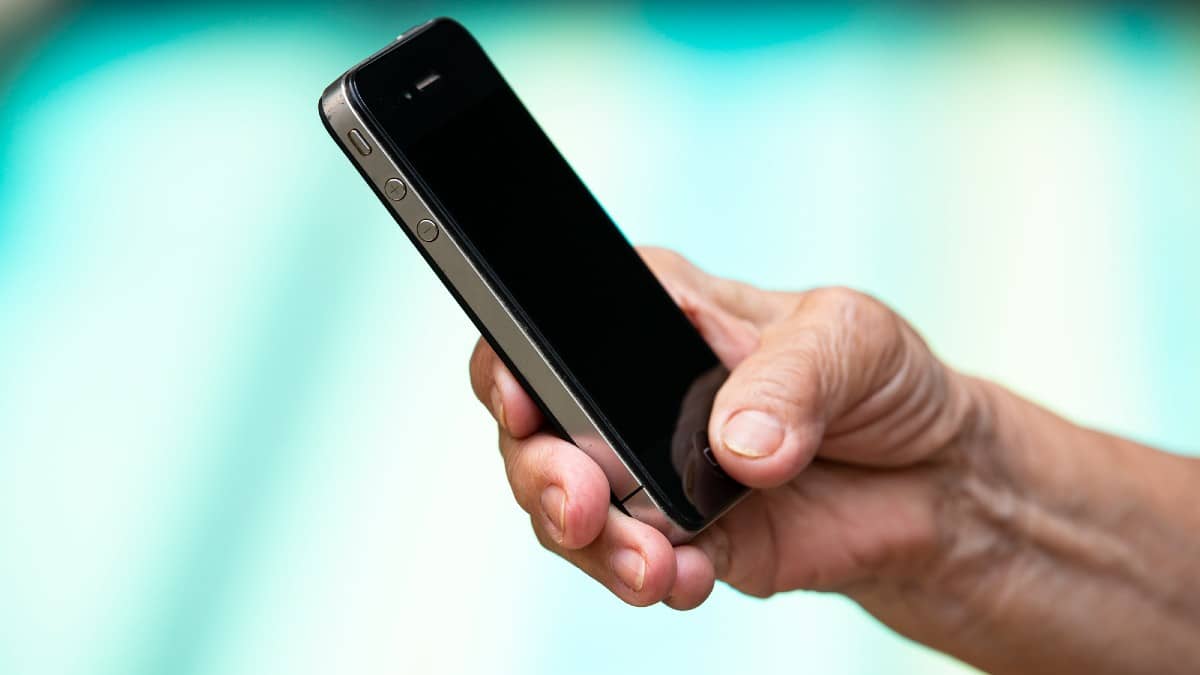 Spending Habits Most People Don’t Notice Bangkok-Thailand-July-15-2019-Senior-womans-hand-using-iPhone
