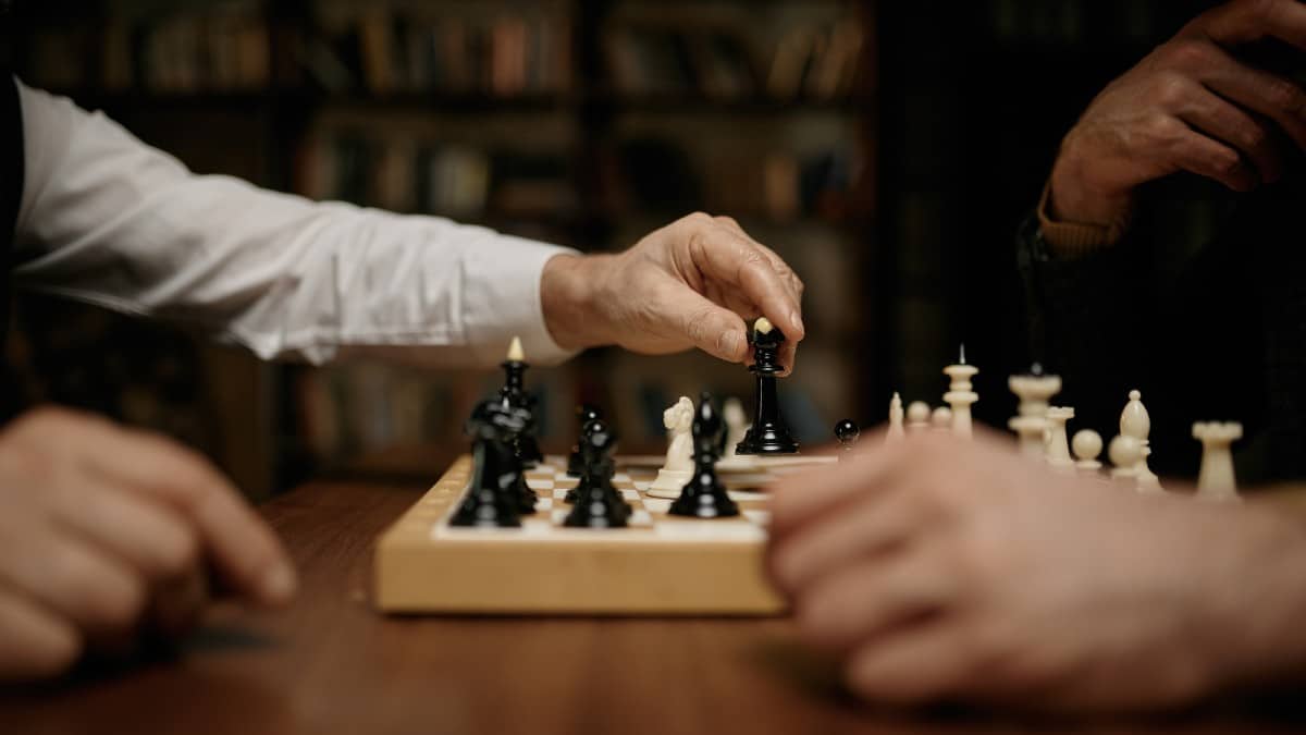 How Rising Costs Limit Kids’ Opportunities Closeup-selective-focus-view-on-hand-moving-chess-queen-figure-on-bo