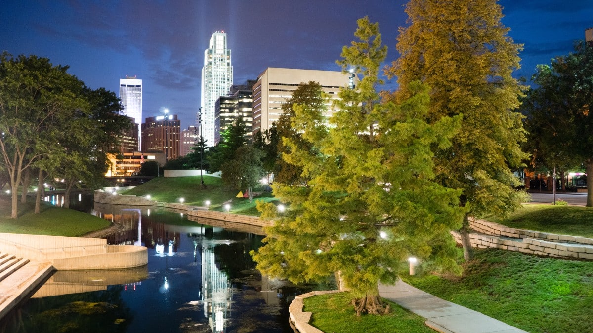 13 Affordable Cities That Ease Financial Stress Omaha-Nebraska-Downtown-City-Park-Skyline-Dusk-Night