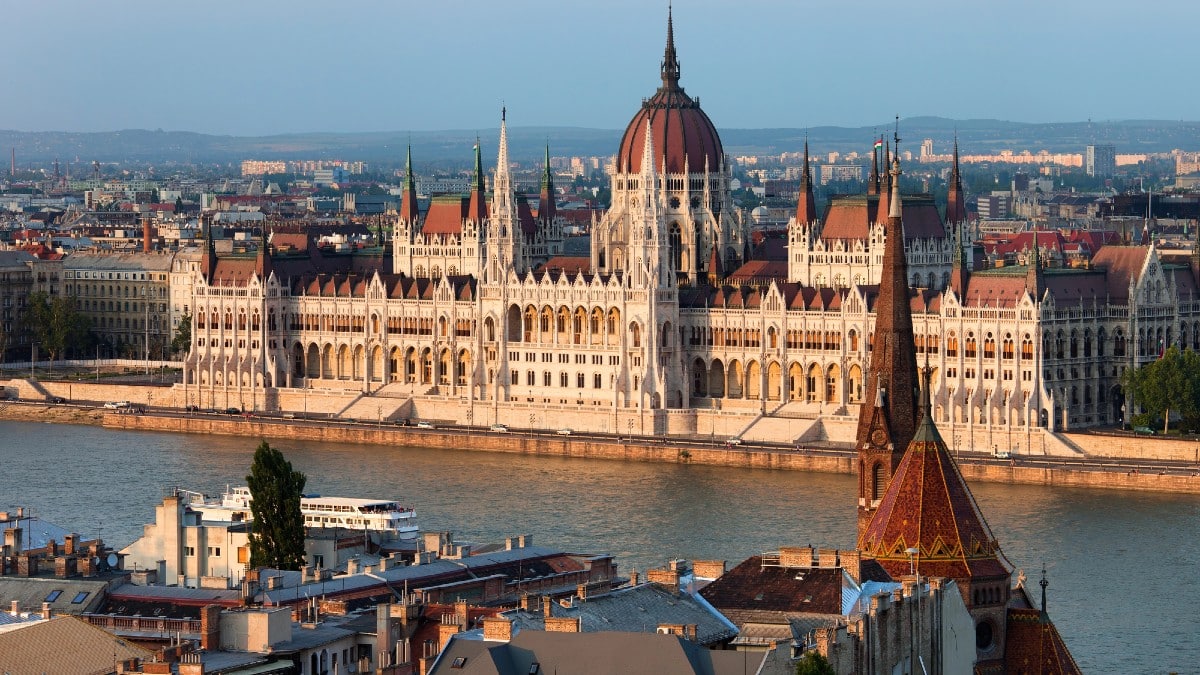 13 Affordable Cities That Ease Financial Stress Parliament-Building-in-Budapest-at-Sunset