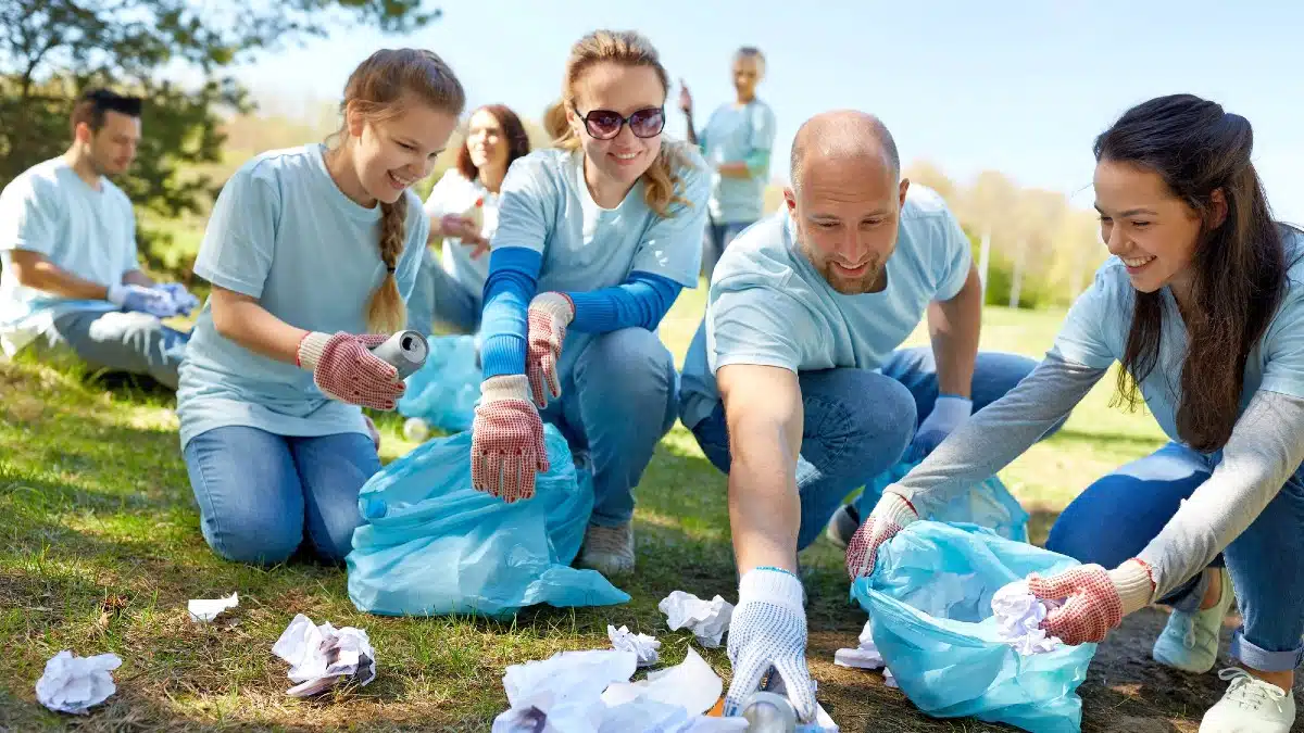12 Surprising Things Boomers Are Investing in to Feel Young Again Volunteers-with-garbage-bags-cleaning-park-area