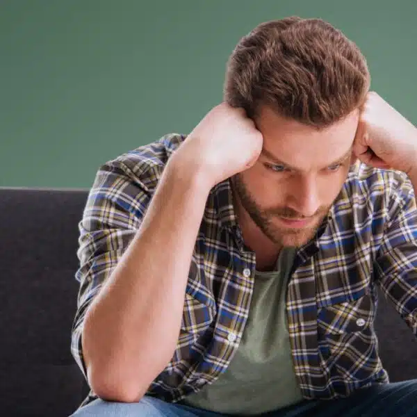 man sad resting on his hands