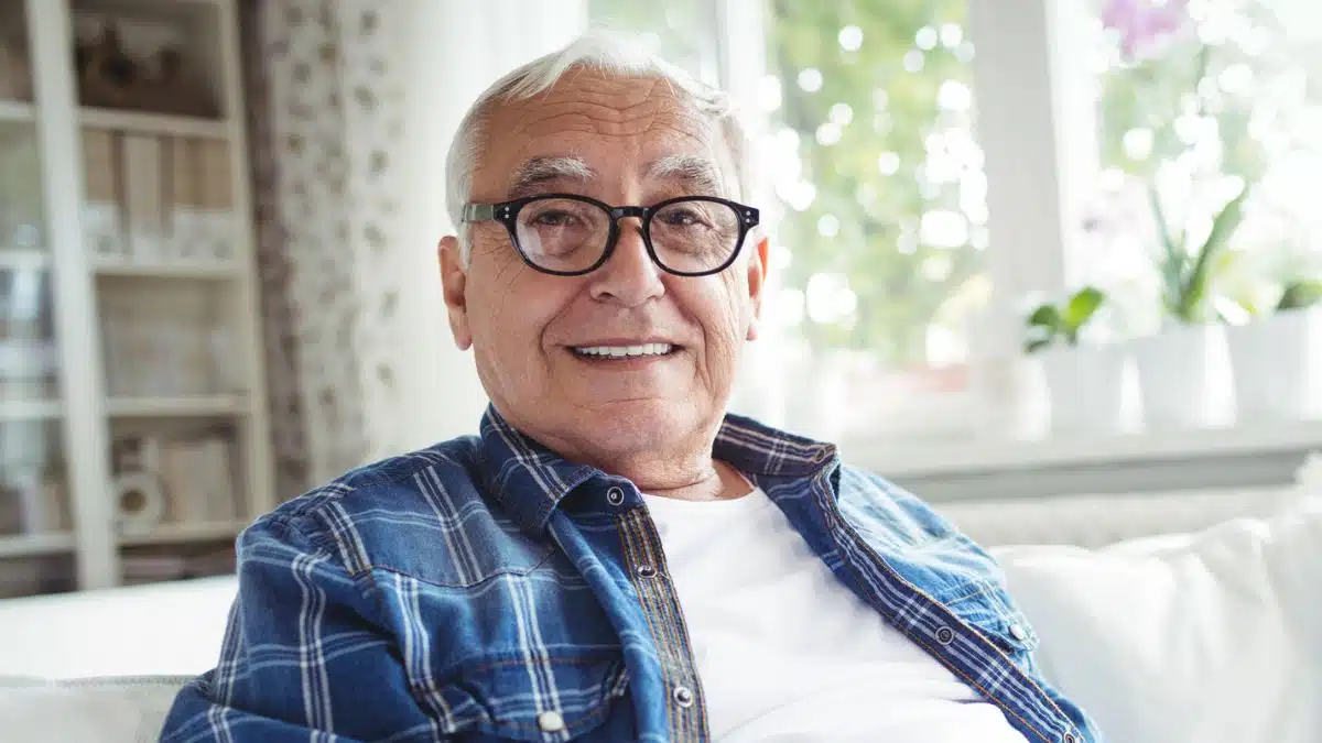14 Rewarding Side Hustles Retirees Will Actually Enjoy man smiling with glasses