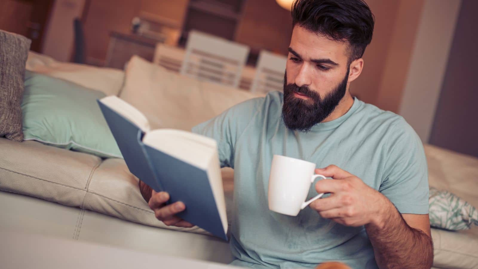 17 Ways to Handle Narcissists at Work Gracefully man-reading-a-paper-book-and-coffee