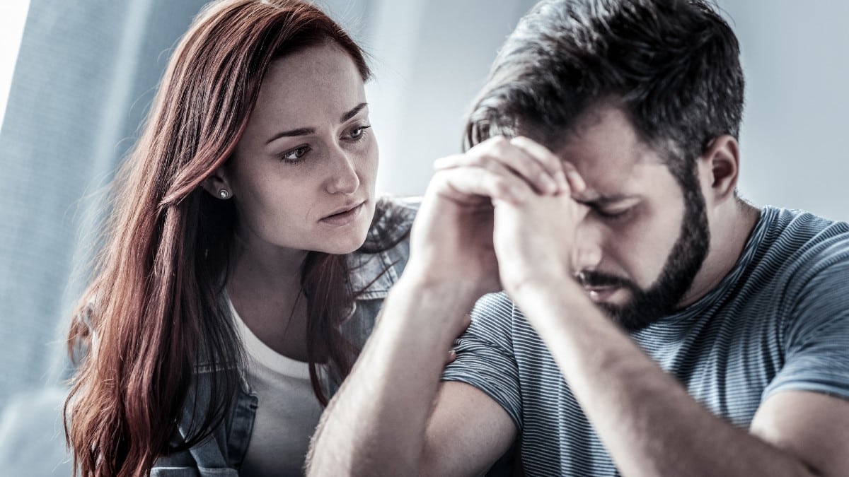 Retirement Risks People Should Plan For Worried-caring-woman-sitting-near-husband-and-touching-to-him