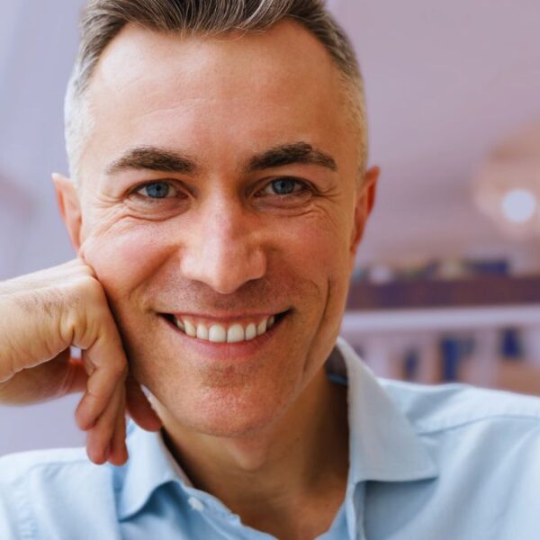 man smiling rich