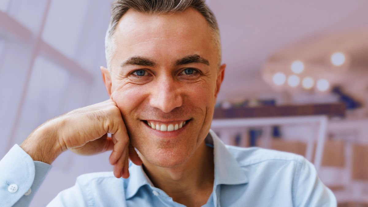man smiling rich