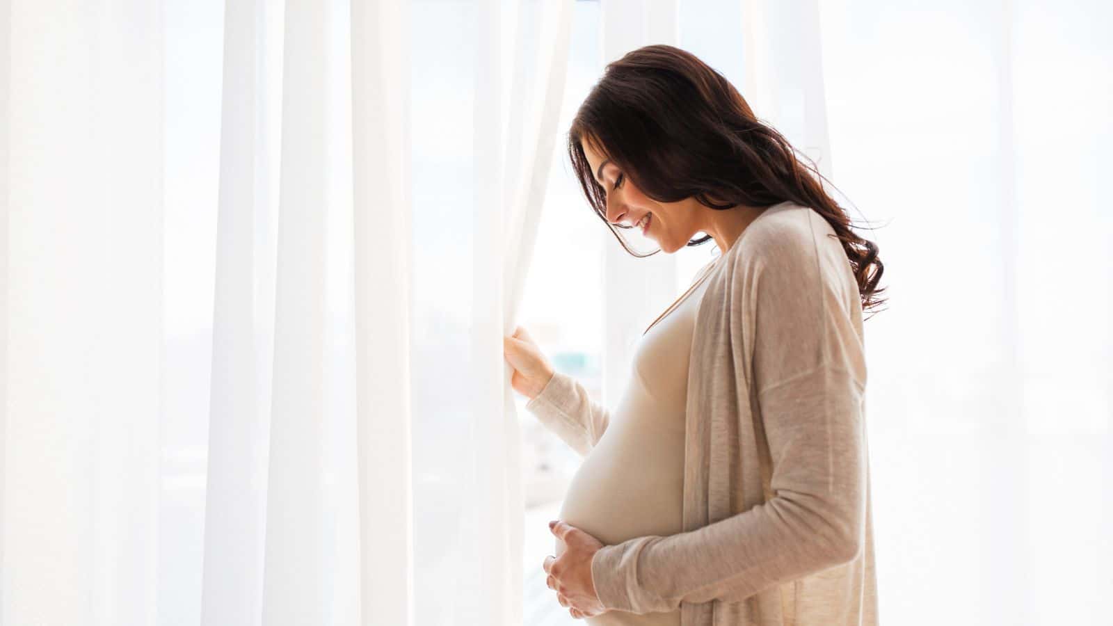 How Money Shapes Millennial Parenthood pregnant-woman-adobe-stock-