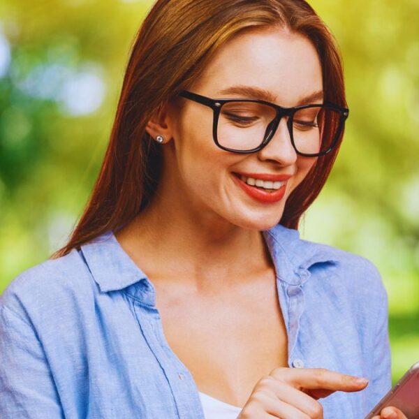 woman glasses phone park