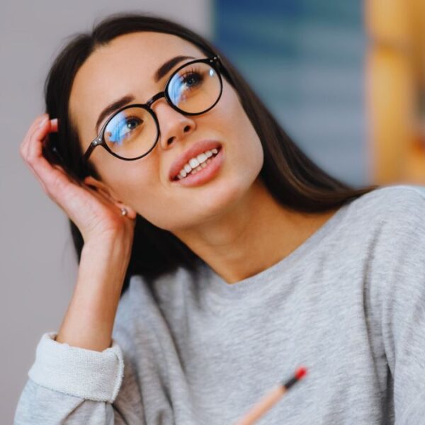 woman laptop thinking glasses