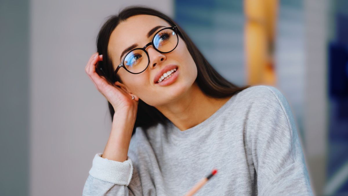 woman laptop thinking glasses