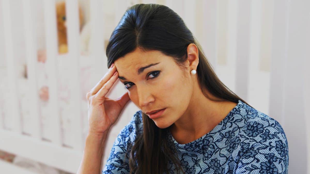 New‑Parent Money Mistakes People Regret woman mom stressed