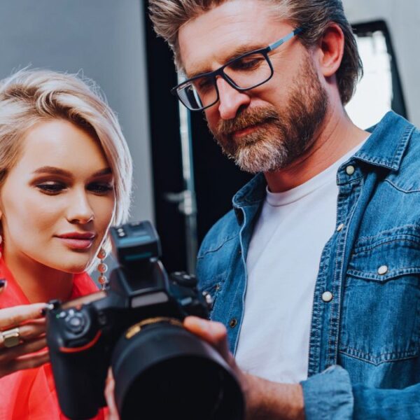 man with camera with woman