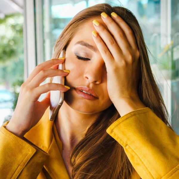 woman phone sad regret