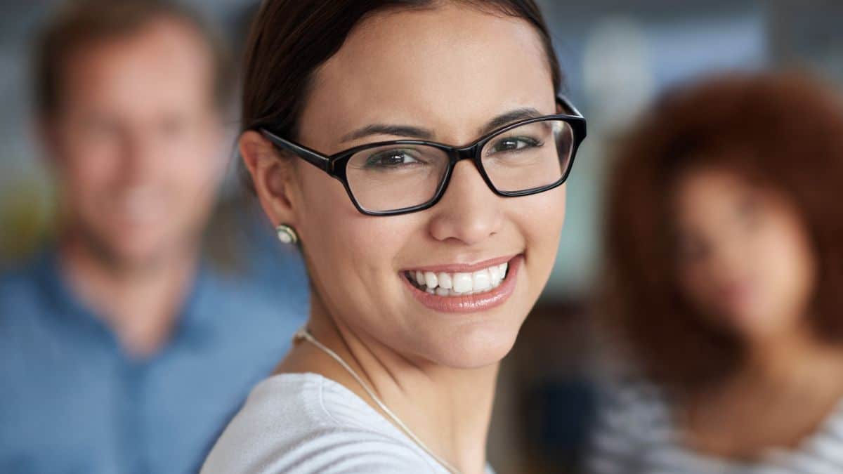 business woman smiling office glasses