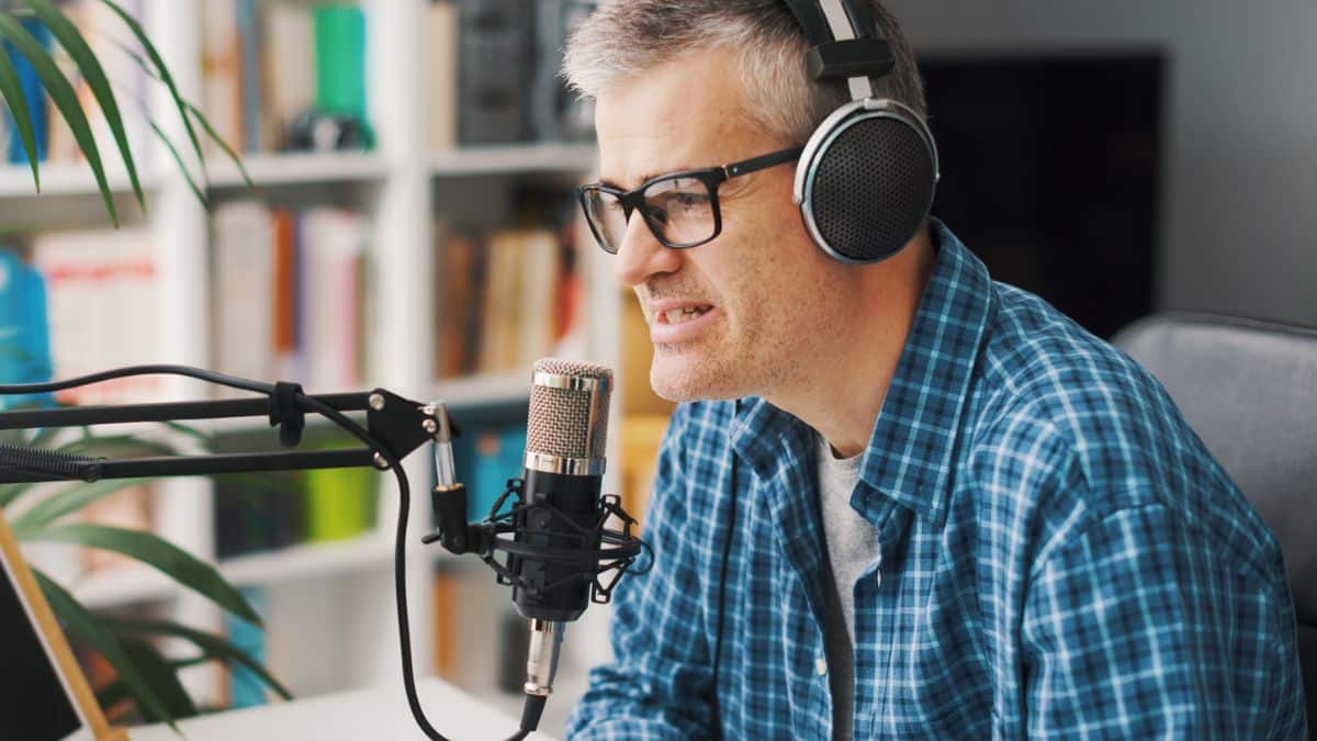 man using a podcast headset