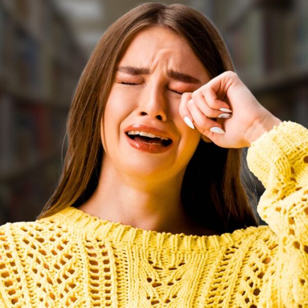 woman crying in library