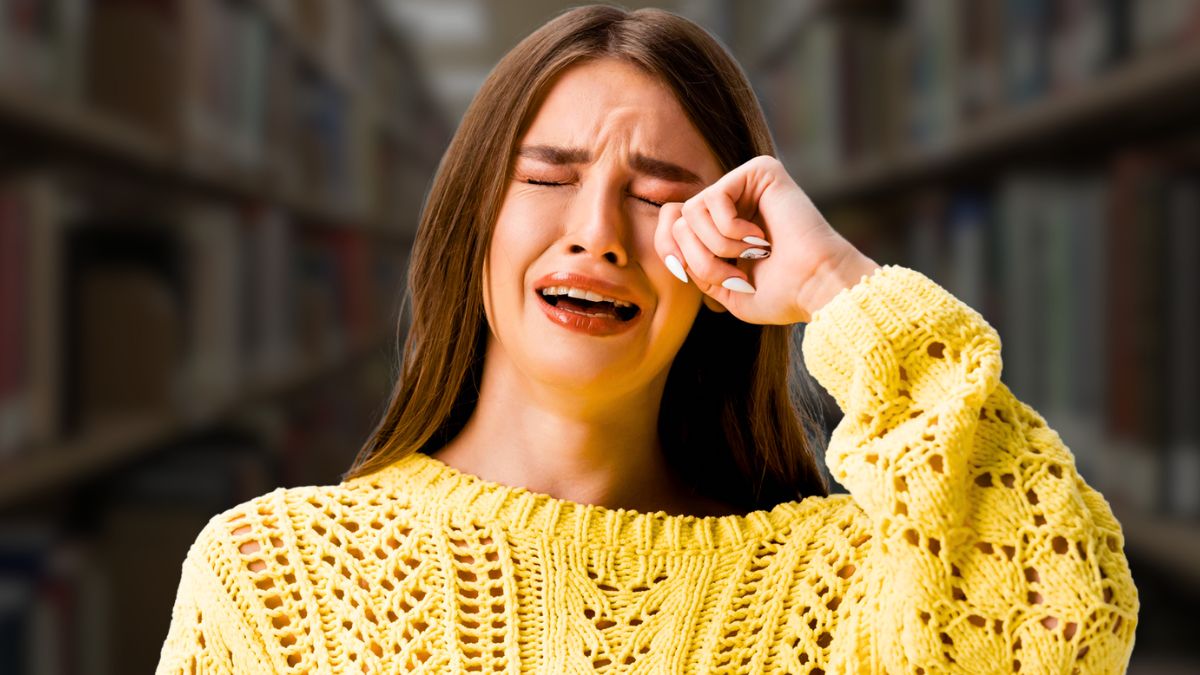 woman crying in library